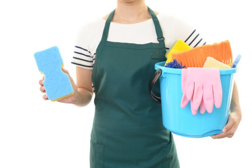 Airbnb cleaner resetting a Urrey short-let living room after checkout