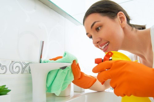 Professional cleaning of desks and shared surfaces in a Urrey workplace