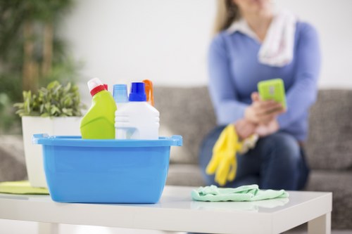 Professional cleaner vacuuming fine dust after building work in a Urrey home