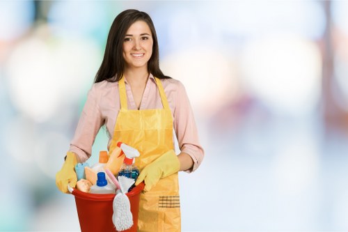 Deep cleaning kitchen and bathroom areas during a Urrey move out clean