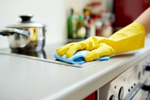 Local cleaners maintaining floors and glass in a Urrey business premises