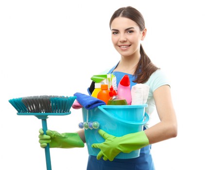 Cleaner preparing a living room for a home clean in Urrey