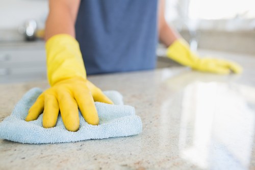Wiping and tidying common areas in a residential block in Urrey